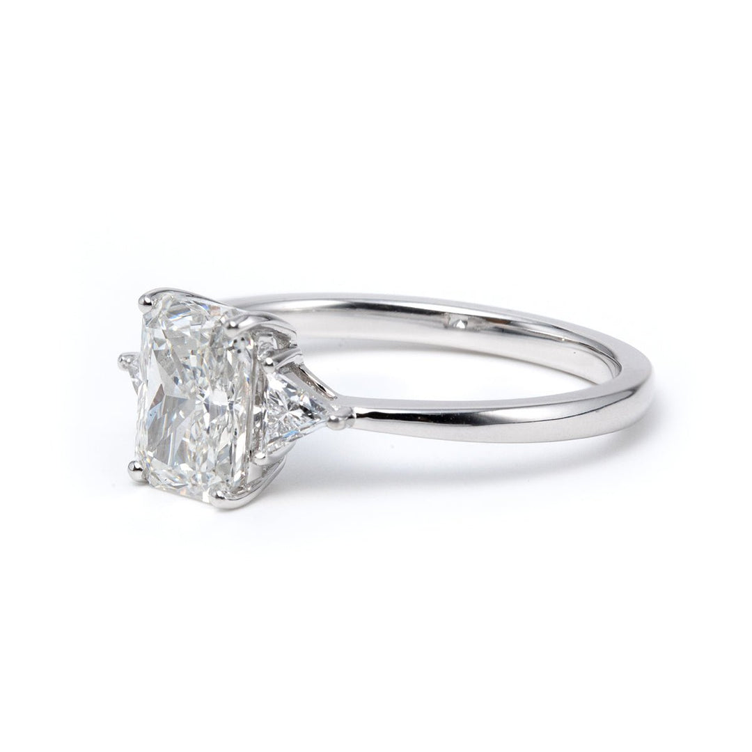 14K White Gold 1.5ct Radiant Cut Lab Diamond Three Stone Ring with Triangular Cut Lab Diamond Side Stones and Tapered Band Design - FIORESE JEWELRY