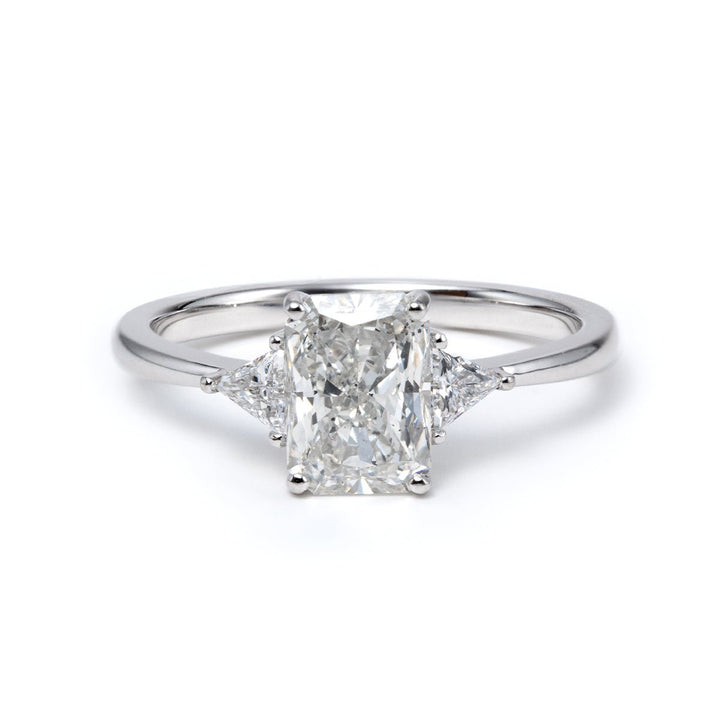 14K White Gold 1.5ct Radiant Cut Lab Diamond Three Stone Ring with Triangular Cut Lab Diamond Side Stones and Tapered Band Design - FIORESE JEWELRY
