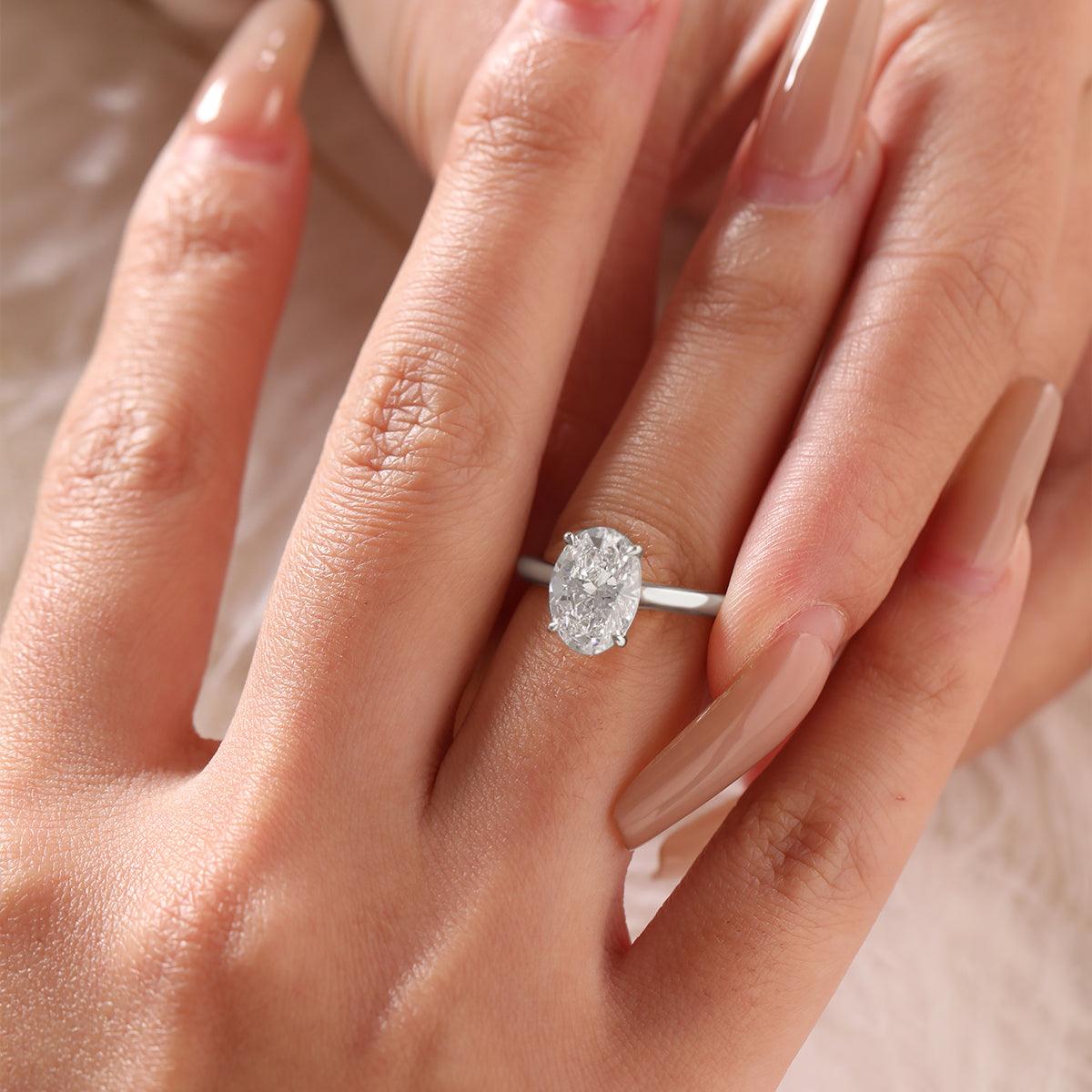 Oval-Cut Lab Diamond Solitaire Ring with 4-Claw Cathedral Setting