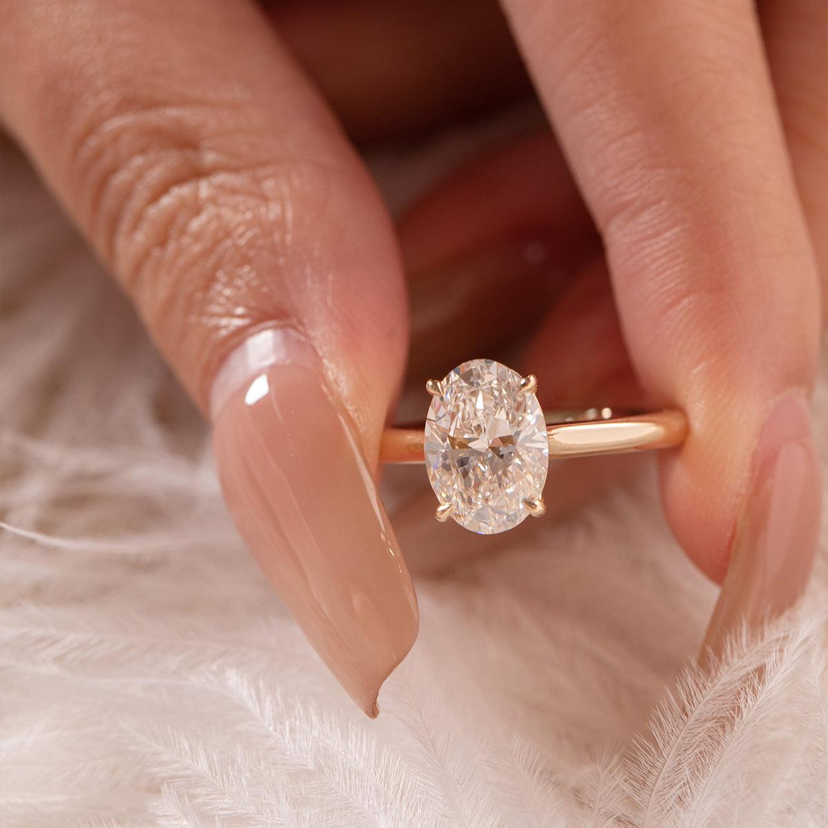 Oval-Cut Lab Diamond Solitaire Ring with 4-Claw Cathedral Setting