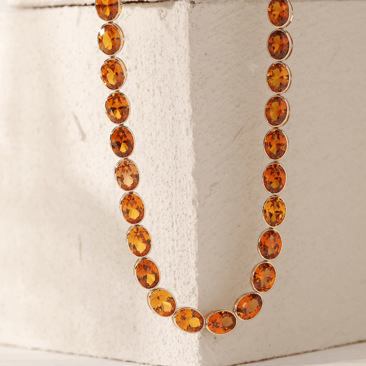 14K Yellow Gold Oval Lab Orange Sapphire Bezel Tennis Necklace with Adjustable Chain - FIORESE JEWELRY