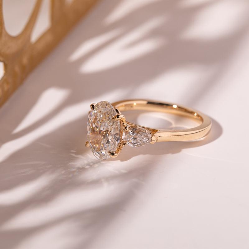 3 CT Oval Cut Lab Diamond 4 - Claw Floral Basket Three - Stone Ring with Pear Side Stones - FIORESE JEWELRY