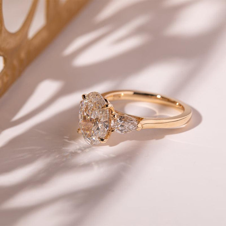 3 CT Oval Cut Lab Diamond 4 - Claw Floral Basket Three - Stone Ring with Pear Side Stones - FIORESE JEWELRY