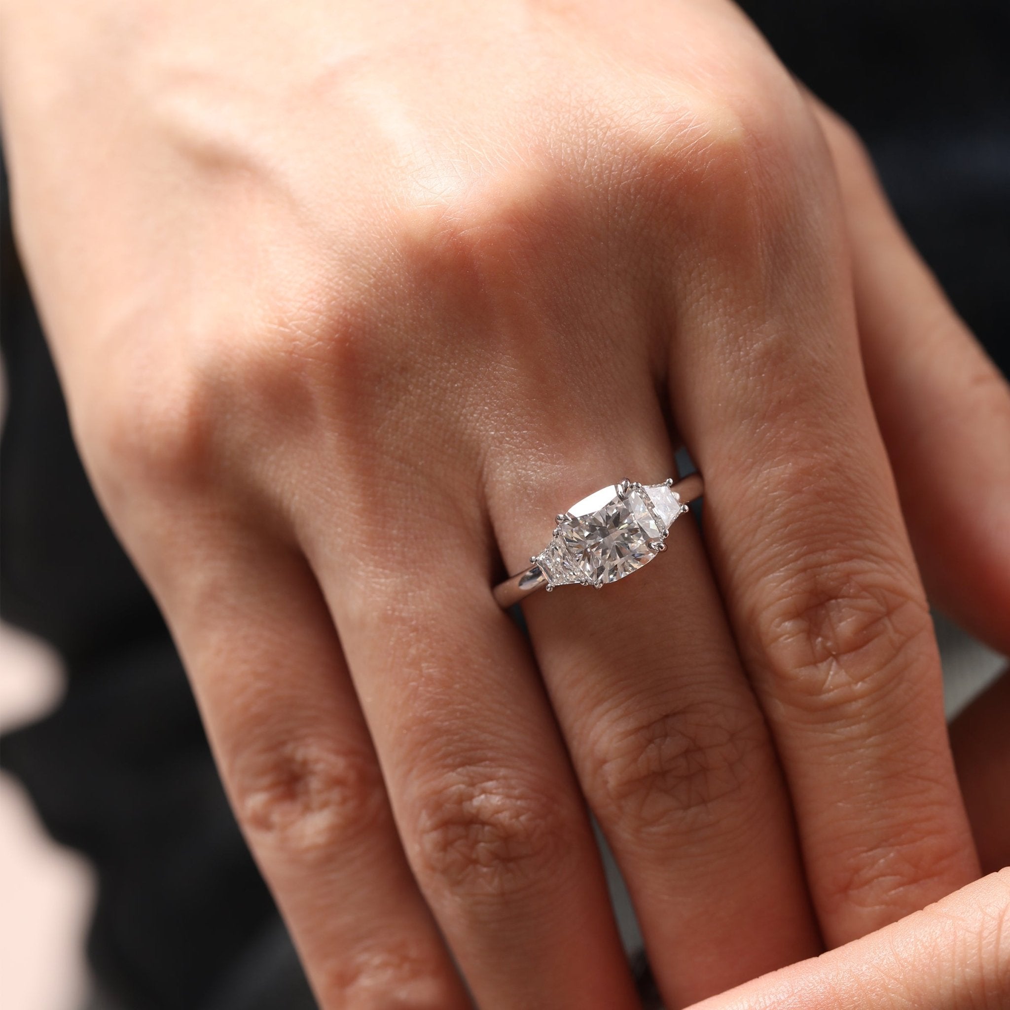 Cushion Brilliant - Cut Lab Diamond Three - Stone Engagement Ring with 4 - Claw Prong Basket Setting and Brilliant - Cut Trapezoid Side Stones - FIORESE JEWELRY