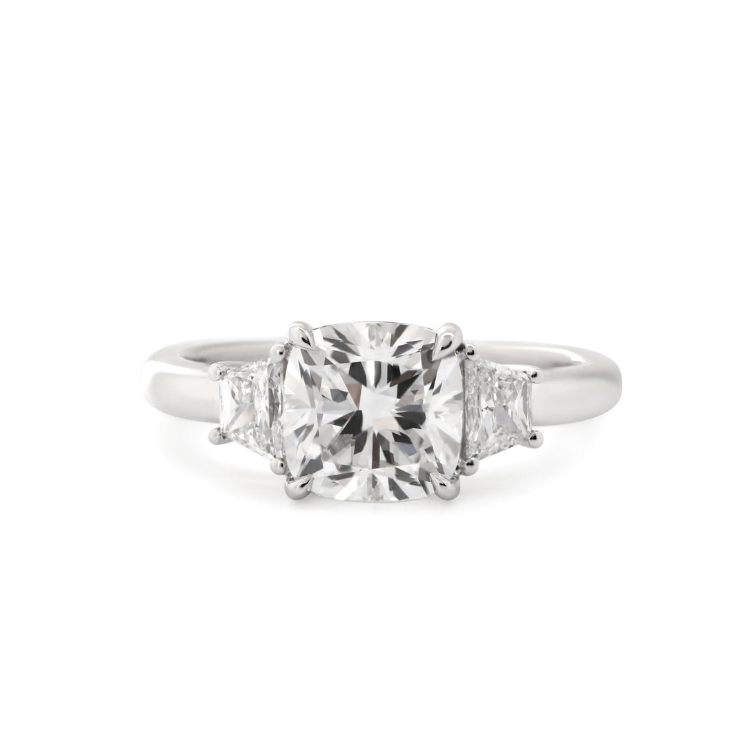 Cushion Brilliant - Cut Lab Diamond Three - Stone Engagement Ring with 4 - Claw Prong Basket Setting and Brilliant - Cut Trapezoid Side Stones - FIORESE JEWELRY