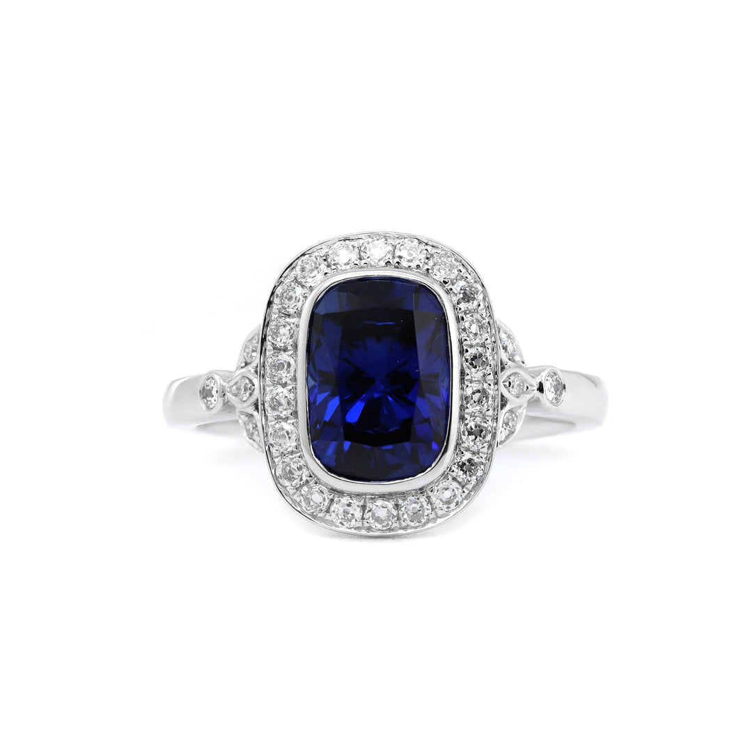 Elongated Cushion-Cut Royal Blue Lab Sapphire Halo Ring with Bezel Setting - FIORESE JEWELRY