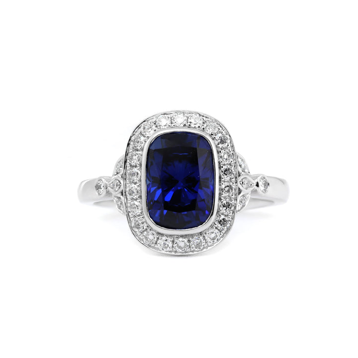 Elongated Cushion-Cut Royal Blue Lab Sapphire Halo Ring with Bezel Setting - FIORESE JEWELRY