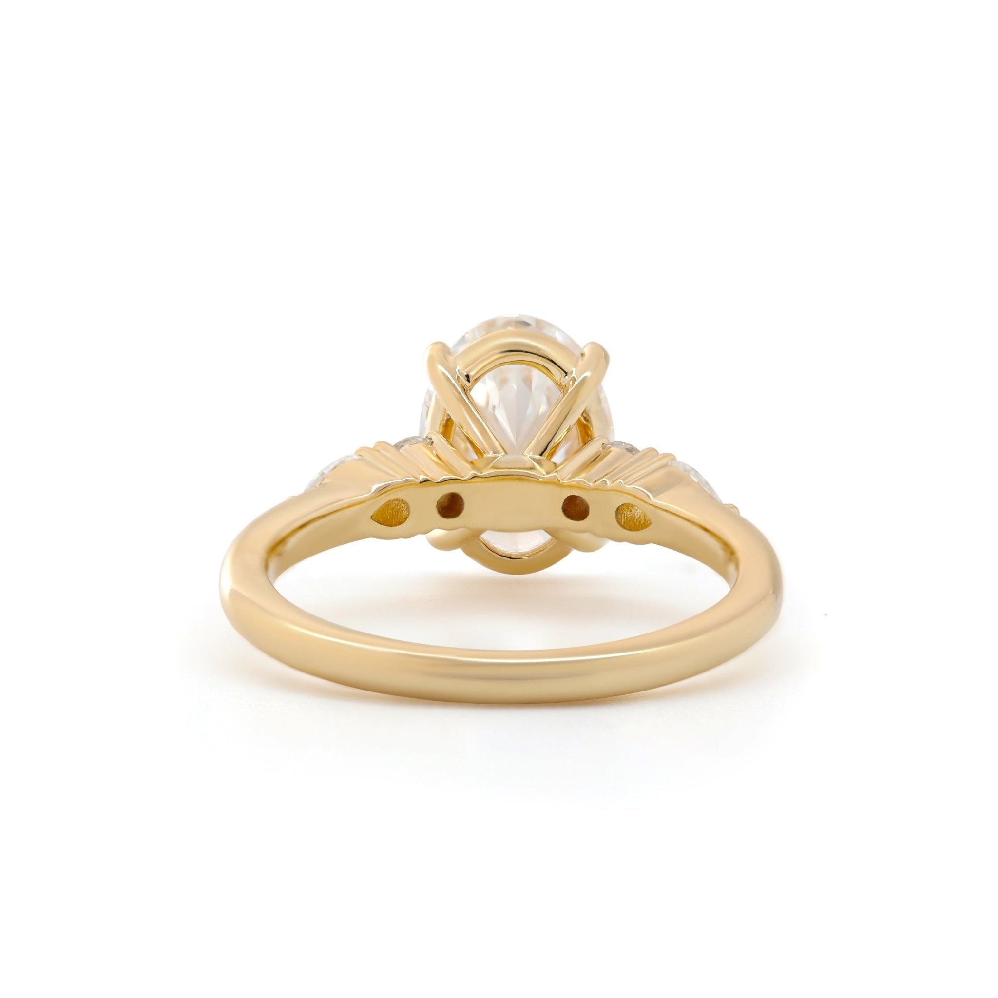 Oval Lab Diamond Ring with Four-Claw Prong Basket Setting and Round and Pear Lab Diamond Side Stones