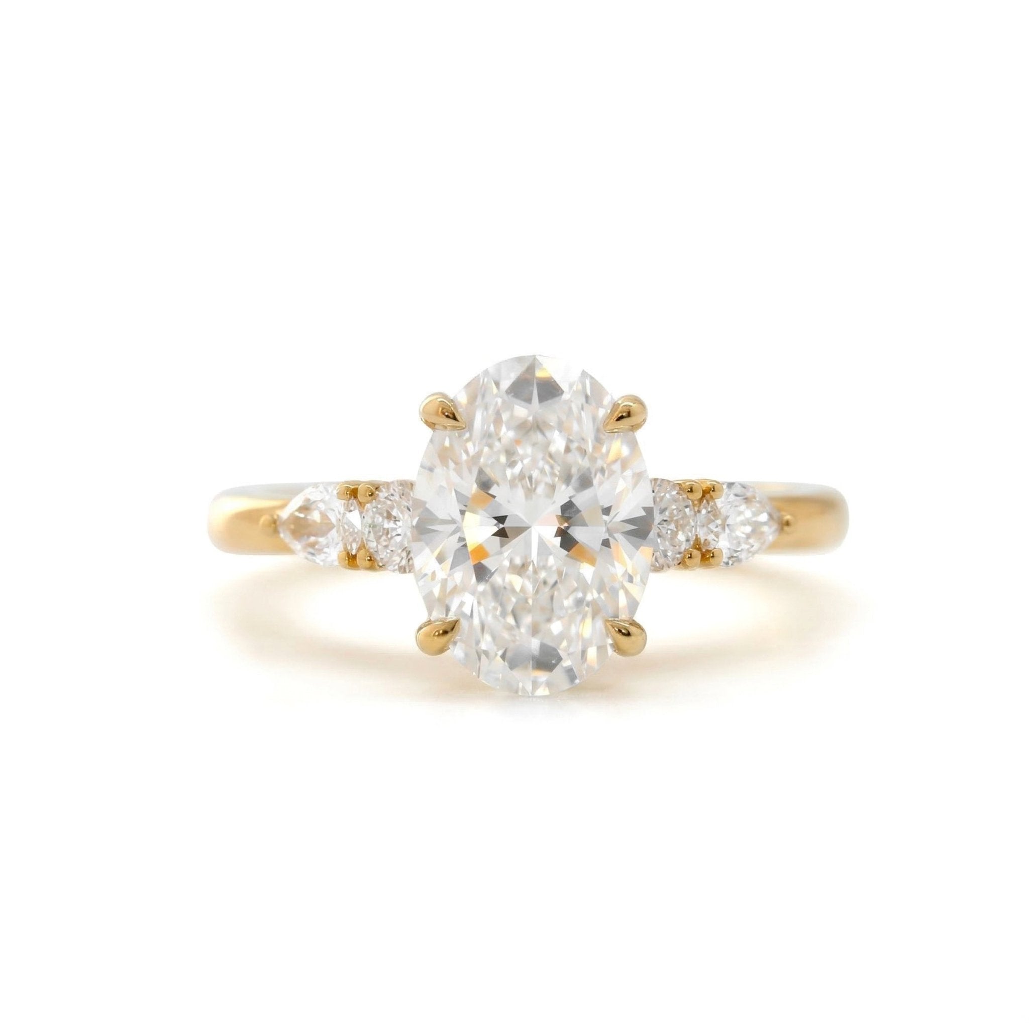 Oval Lab Diamond Ring with Four - Claw Prong Basket Setting and Round and Pear Lab Diamond Side Stones - FIORESE JEWELRY