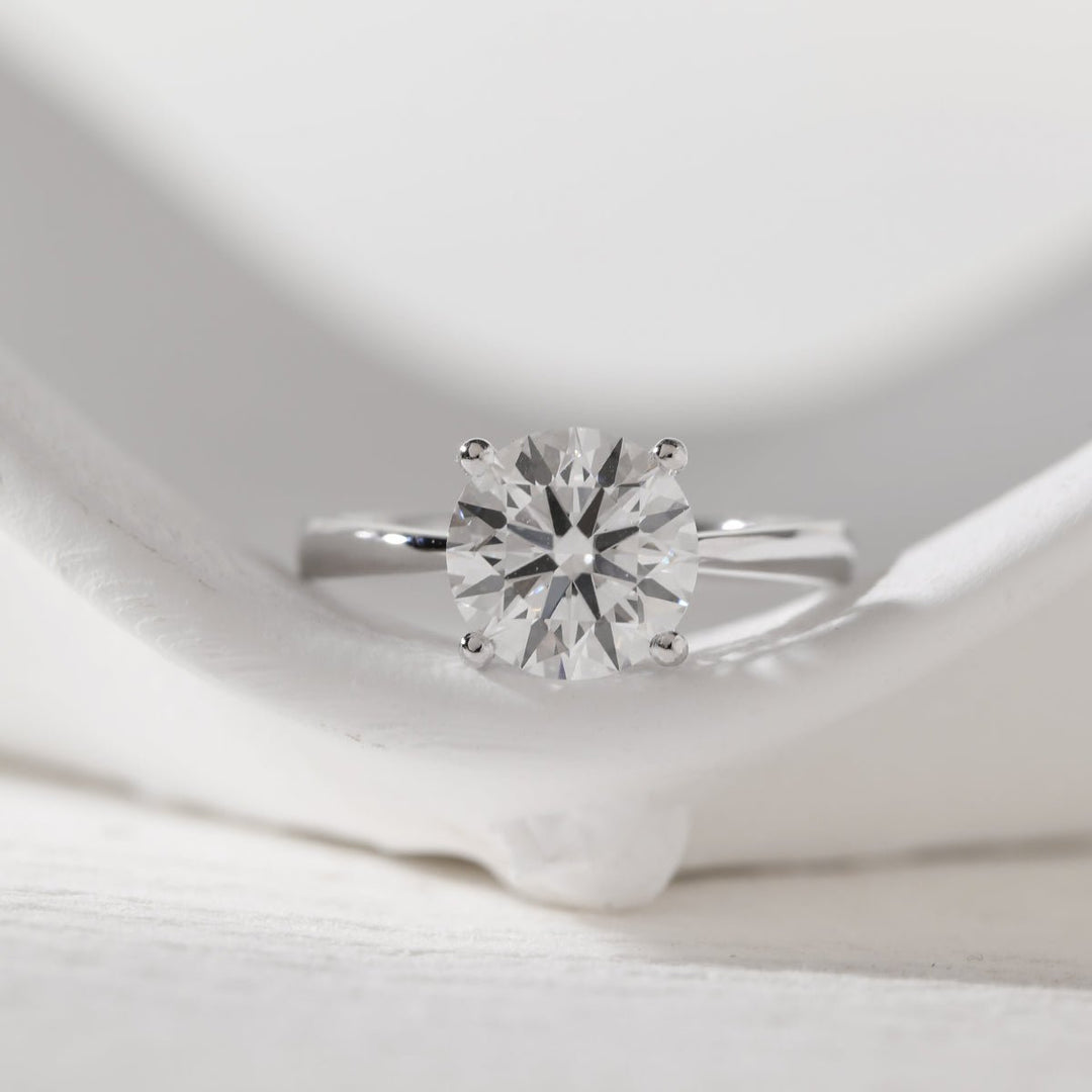 Platinum 3ct Round Lab Diamond 4 Round Prong Basket Solitaire Ring with Tapered Band Design - FIORESE JEWELRY