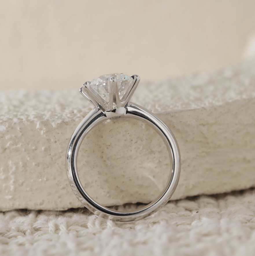 Round-Cut Diamond Solitaire Engagement Ring with Six-Claw Prongs and Knife-Edge Band - FIORESE JEWELRY